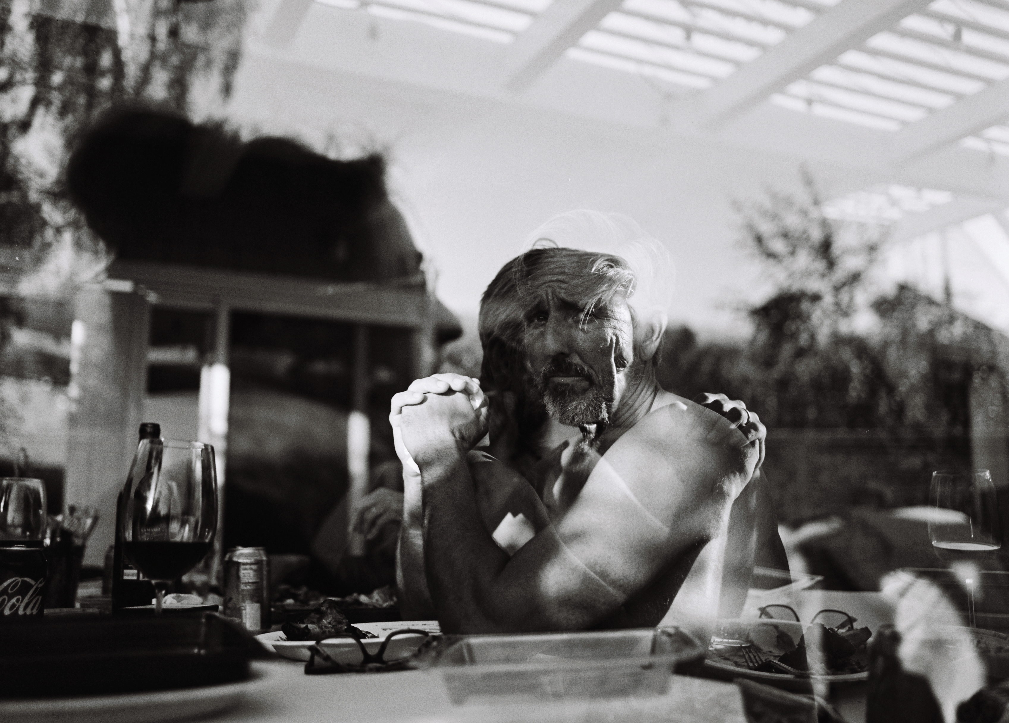 Black and white double exposure portrait at dinner