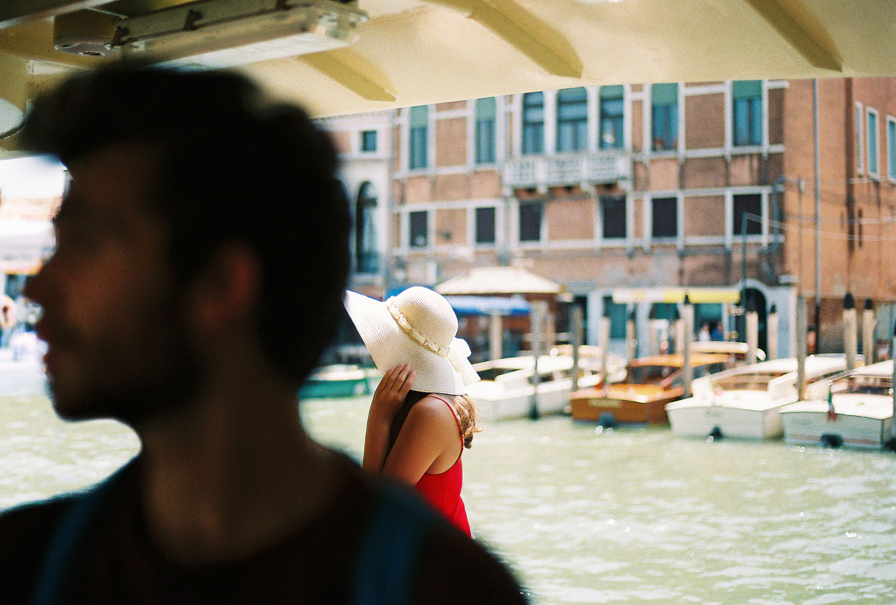 Canal photograph with a woman in a white hat